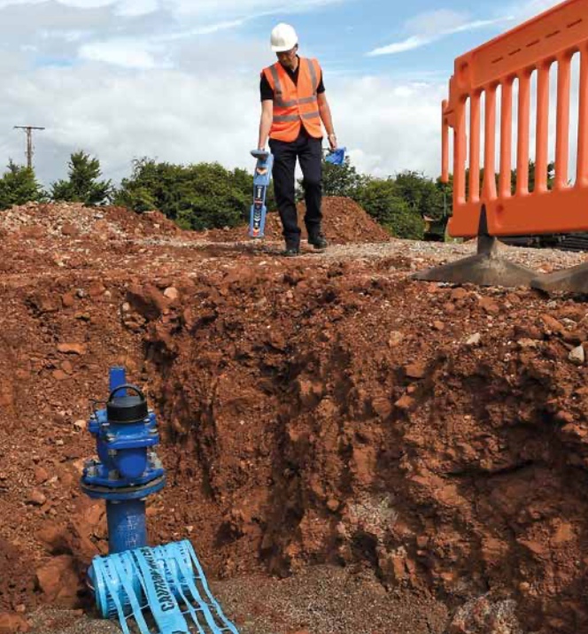 Worker using a GPR hand-held device in the field